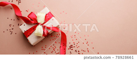 Red Beige theme craft gift box present gift with bright red ribbon and confetti star shape, holiday, xmas, christmas 2022. shopping, sale banner, flyer, coupon concept, copy space Red Beige theme craft gift box present gift with bright red ribbon and confetti star shape, holiday, xmas, christmas 2022. shopping, sale banner, flyer, coupon concept, copy space 78928661