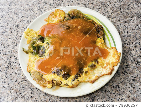oyster omelet, a snack in Kinmen, Taiwan's outlying islands. This is a very popular local snack in Kinmen. oyster omelet, a snack in Kinmen, Taiwan's outlying islands. This is a very popular local snack in Kinmen. 78930257