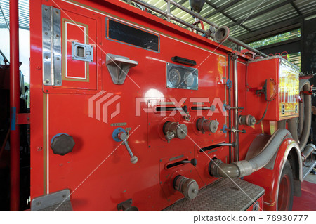 Close up of a fire truck machine engine components, an emergency accident rescue safty and security equipment in station. Ambulance. Service. Close up of a fire truck machine engine components, an emergency accident rescue safty and security equipment in station. Ambulance. Service. 78930777