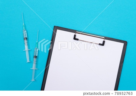 Vaccination or Revaccination Concept - Two Medical Syringe on Blue Table 78932763