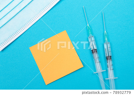 Vaccination or Revaccination Concept - Two Medical Syringe on Blue Table 78932779