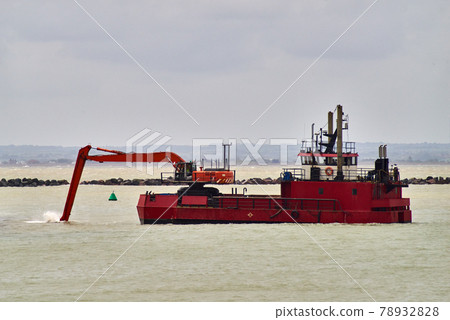 An excavator on a dredging ship An excavator on a dredging ship 78932828