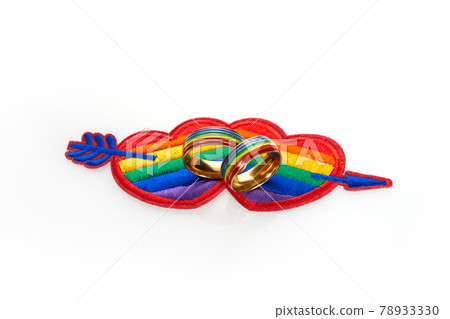 Love wins concept with a multicolored heart and wedding rings. Equality and love protection 78933330