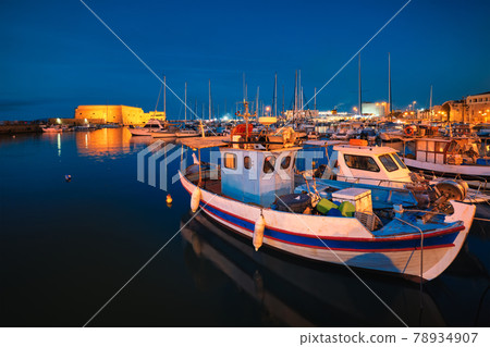 Venetian Fort in Heraklion and moored fishing boats, Crete Island, Greece 78934907