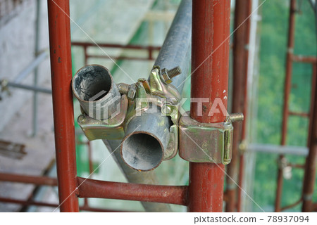 SELANGOR, MALAYSIA -NOVEMBER 10, 2016: Scaffolding connector detail at the construction site. The connector bind or tie scaffolding or safety pipe together.  78937094