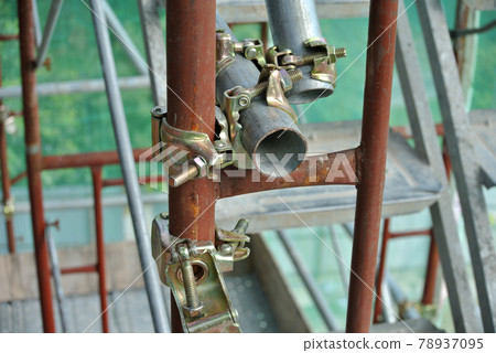 SELANGOR, MALAYSIA -NOVEMBER 10, 2016: Scaffolding connector detail at the construction site. The connector bind or tie scaffolding or safety pipe together.  78937095
