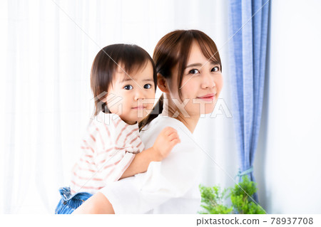 Girl rejoices with mom's piggyback ride Girl rejoices with mom's piggyback ride 78937708