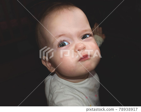 Portrait of a cute little child who is offended or angry 78938917