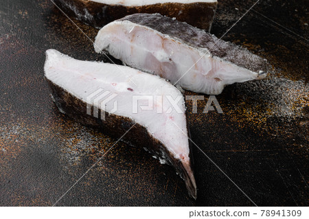 Halibut fish frozen steak, on old dark rustic table background, with copy space for text Halibut fish frozen steak, on old dark rustic table background, with copy space for text 78941309