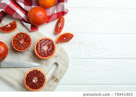 Concept of citrus with red oranges on white wooden table Concept of citrus with red oranges on white wooden table 78941903
