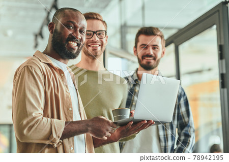 Three young multiracial working men posing for camera 78942195