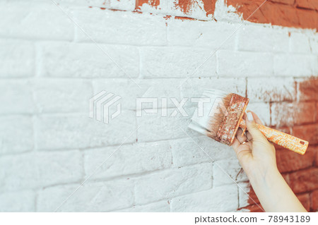 Paint brick wall white with brush Paint brick wall white with brush 78943189