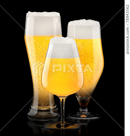Set of fresh light beer glasses with bubble froth isolated on black background. Set of fresh light beer glasses with bubble froth isolated on black background. 78943562