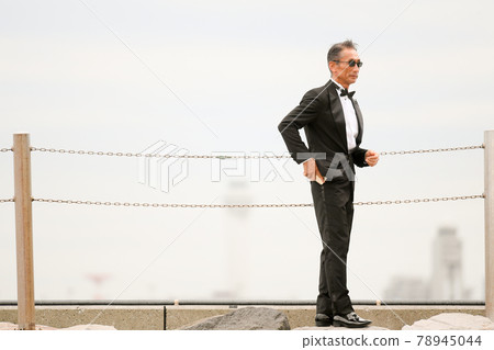Senior, middle-aged man in a black tie wearing sunglasses Senior, middle-aged man in a black tie wearing sunglasses 78945044