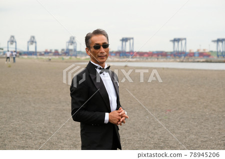Image of a successful man wearing a black tie wearing sunglasses Image of a successful man wearing a black tie wearing sunglasses 78945206