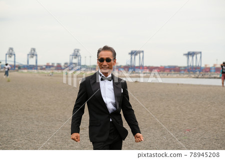 Image of a successful man wearing a black tie wearing sunglasses Image of a successful man wearing a black tie wearing sunglasses 78945208