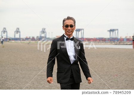Image of a successful man wearing a black tie wearing sunglasses Image of a successful man wearing a black tie wearing sunglasses 78945209