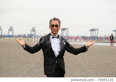 Image of a successful man wearing a black tie wearing sunglasses Image of a successful man wearing a black tie wearing sunglasses 78945210
