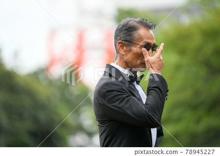 Image of a successful man wearing a black tie wearing sunglasses Image of a successful man wearing a black tie wearing sunglasses 78945227