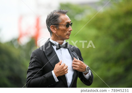 Image of a successful man wearing a black tie wearing sunglasses Image of a successful man wearing a black tie wearing sunglasses 78945231