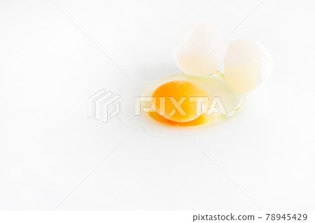 white egg is broken and leaked on a white background. 78945429