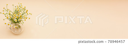 small chamomile flowers in a glass vase on small chamomile flowers in a glass vase on 78946457