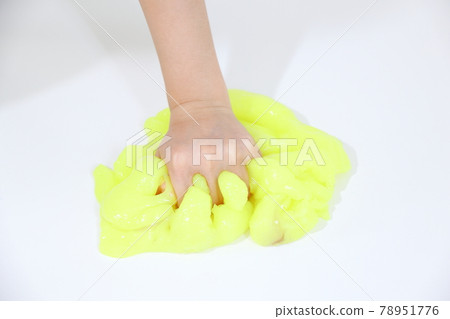 Hands buried in yellow slime Hands buried in yellow slime 78951776