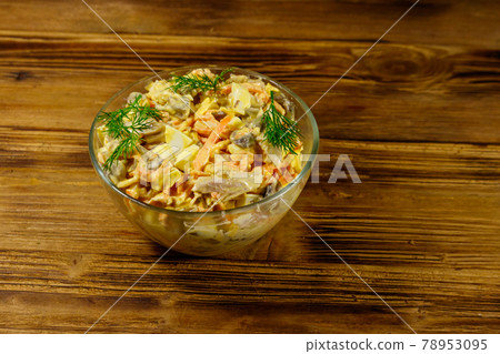 Tasty salad with chicken breast, roasted mushrooms, carrots, grated cheese, eggs and mayonnaise on wooden table Tasty salad with chicken breast, roasted mushrooms, carrots, grated cheese, eggs and mayonnaise on wooden table 78953095