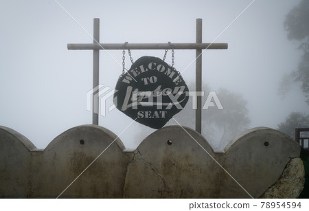 Lipton Seat Sign, Cold misty conditions on the hilltop, Travel destination, and a landmark for a great viewpoint. 78954594