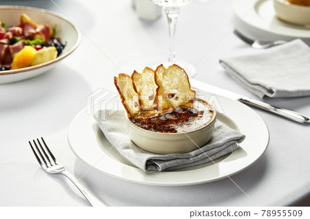 Mushroom julienne with croutons on the festive table, mushroom julienne and other snacks on the table with a light tablecloth 78955509