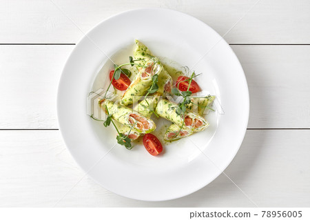 Spinach crepes with salted salmon and cream cheese Spinach crepes with salted salmon and cream cheese 78956005