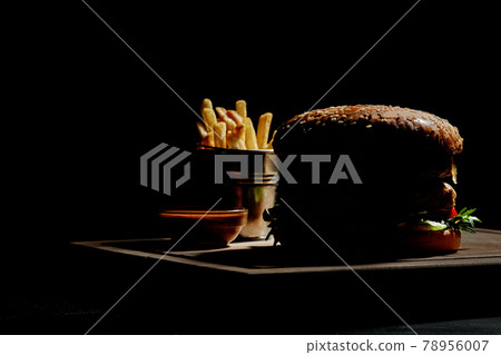 Silhouette of hamburger with french fries and sauce Silhouette of hamburger with french fries and sauce 78956007