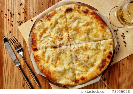 Megrelian khachapuri with melted sulguni cheese with wine Megrelian khachapuri with melted sulguni cheese with wine 78956038