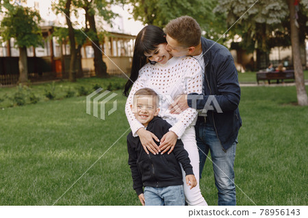Cute family playing in a summer park Cute family playing in a summer park 78956143