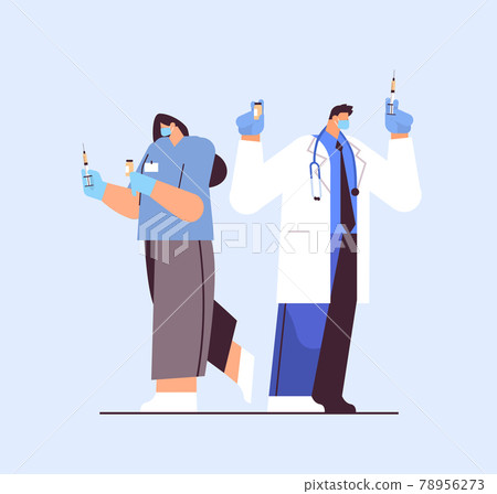 doctors in protective masks holding syringe and bottle vial coronavirus vaccine development fight against covid-19 78956273