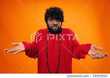 Black clueless man gesturing I don't know 78959004