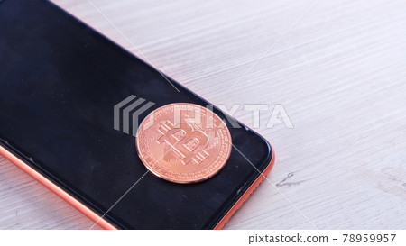 smartphone with bitcoin coin for shopping on a light background. Online shopping concept, blockchain smartphone with bitcoin coin for shopping on a light background. Online shopping concept, blockchain 78959957
