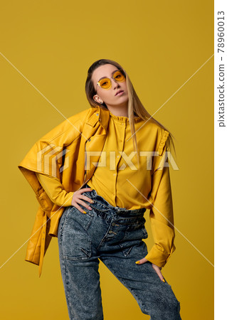 fashionable blonde woman in sunglasses and leather jacket 78960013