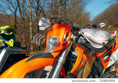 Close-up details of cross motorcycle parked on ground Close-up details of cross motorcycle parked on ground 78960464
