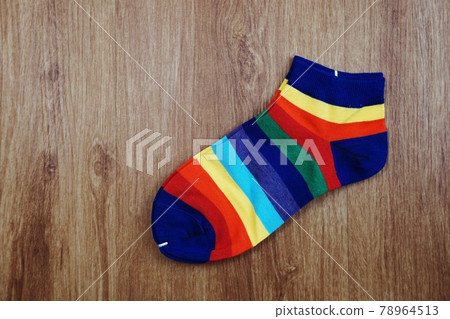 Top View of Colorful socks on wooden background Top View of Colorful socks on wooden background 78964513