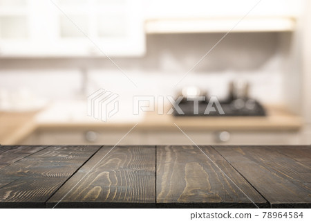 Empty wooden tabletop and blurred kitchen. 78964584