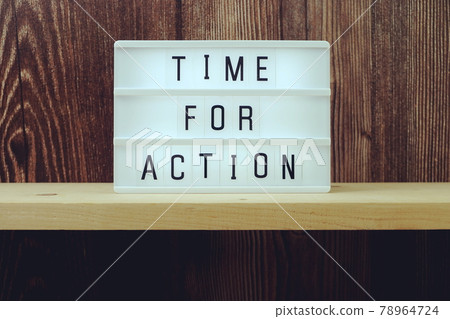 Time for Action word in light box on wooden background Time for Action word in light box on wooden background 78964724