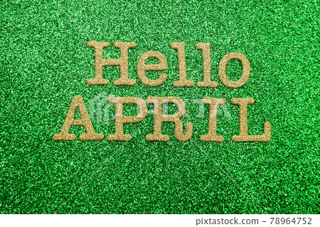 Hello April alphabet letters on green glitter background Hello April alphabet letters on green glitter background 78964752