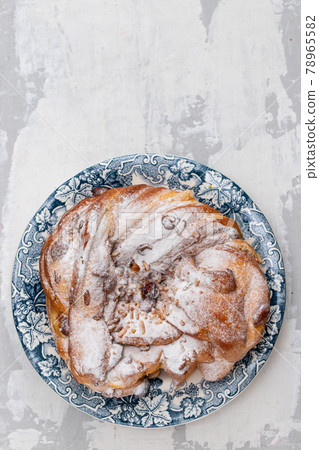 Typical Portuguese Easter Cake with dry nuts on beautiful dish 78965582