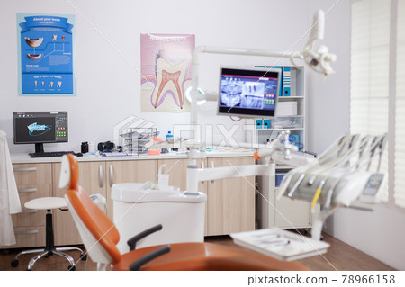 Modern orange dentist cabinet with sterile utensils Modern orange dentist cabinet with sterile utensils 78966158