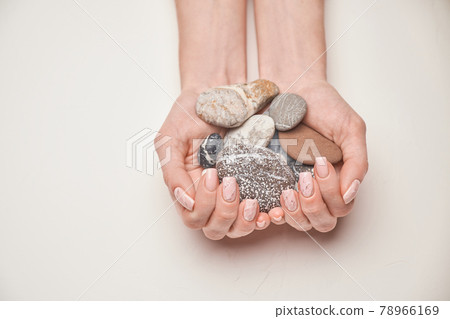 Woman hands with beautiful manicure on light background 78966169