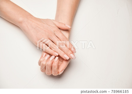 Woman hands with beautiful manicure on light background 78966185