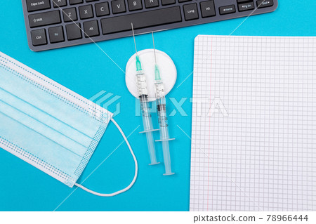 Vaccination or Revaccination Concept - Three Insulin Syringe on Blue Table 78966444