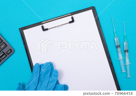 Vaccination or Revaccination Concept - Two Medical Syringe on Blue Table 78966458