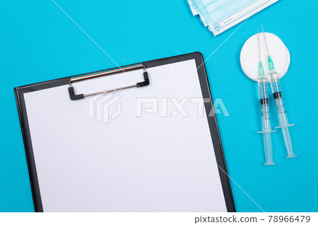 Vaccination or Revaccination Concept - Two Medical Syringe on Blue Table 78966479
